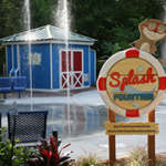 The Splash Fountain sign sitting in front of water spraying up from the Splash Fountain.