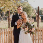 Wedding couple in Twiga Terrace with two giraffes